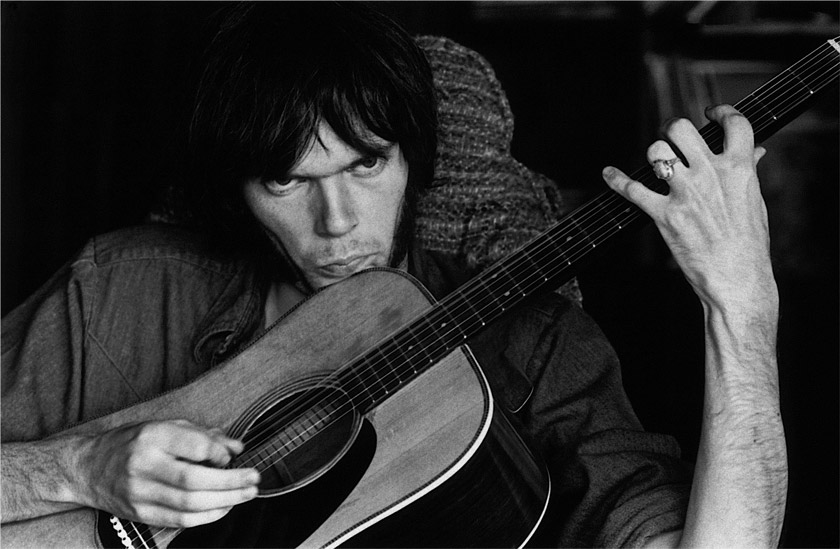 Neil Young Rehearsing for Deja Vu at Stephens House, 1969. Studio City, Los Angeles. When viewed closely, the bass string is vibrating.